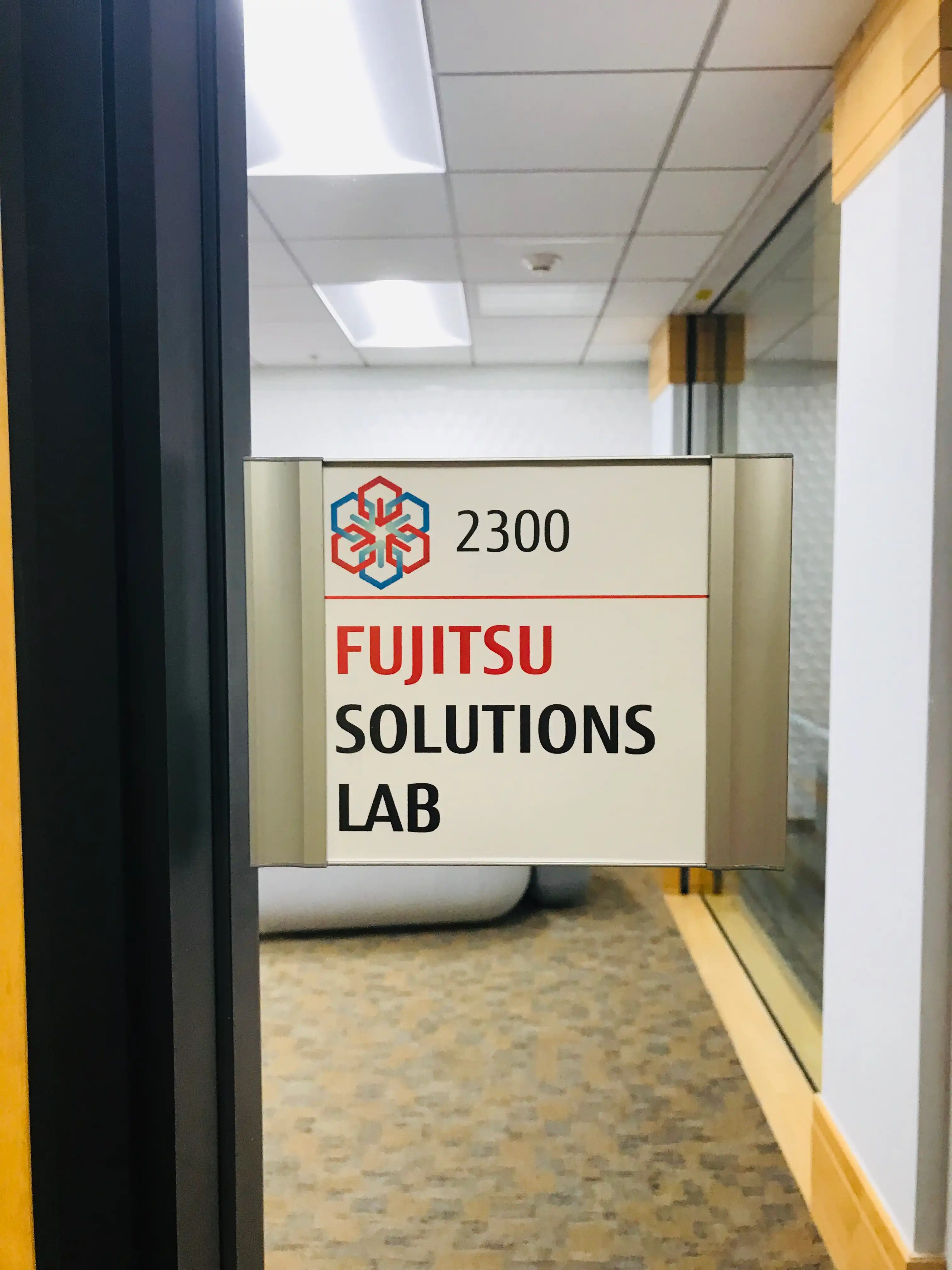 Fujitsu conference room wayfinding sign — modular frame system, San Jose