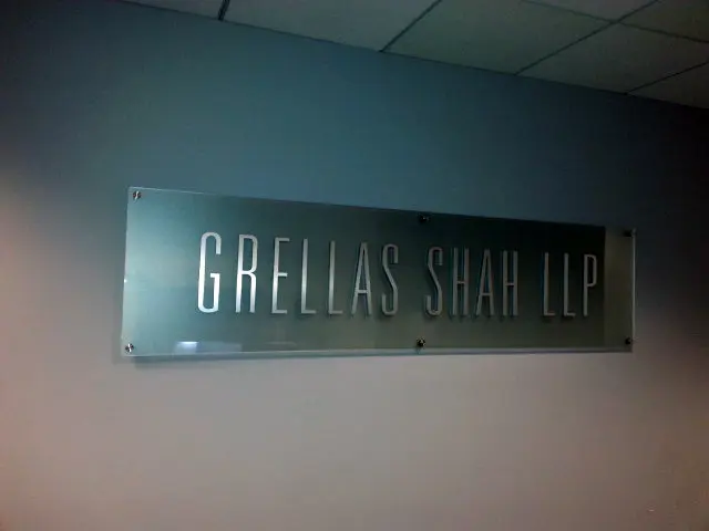 Grellas Shah LLP frosted acrylic panel lobby sign