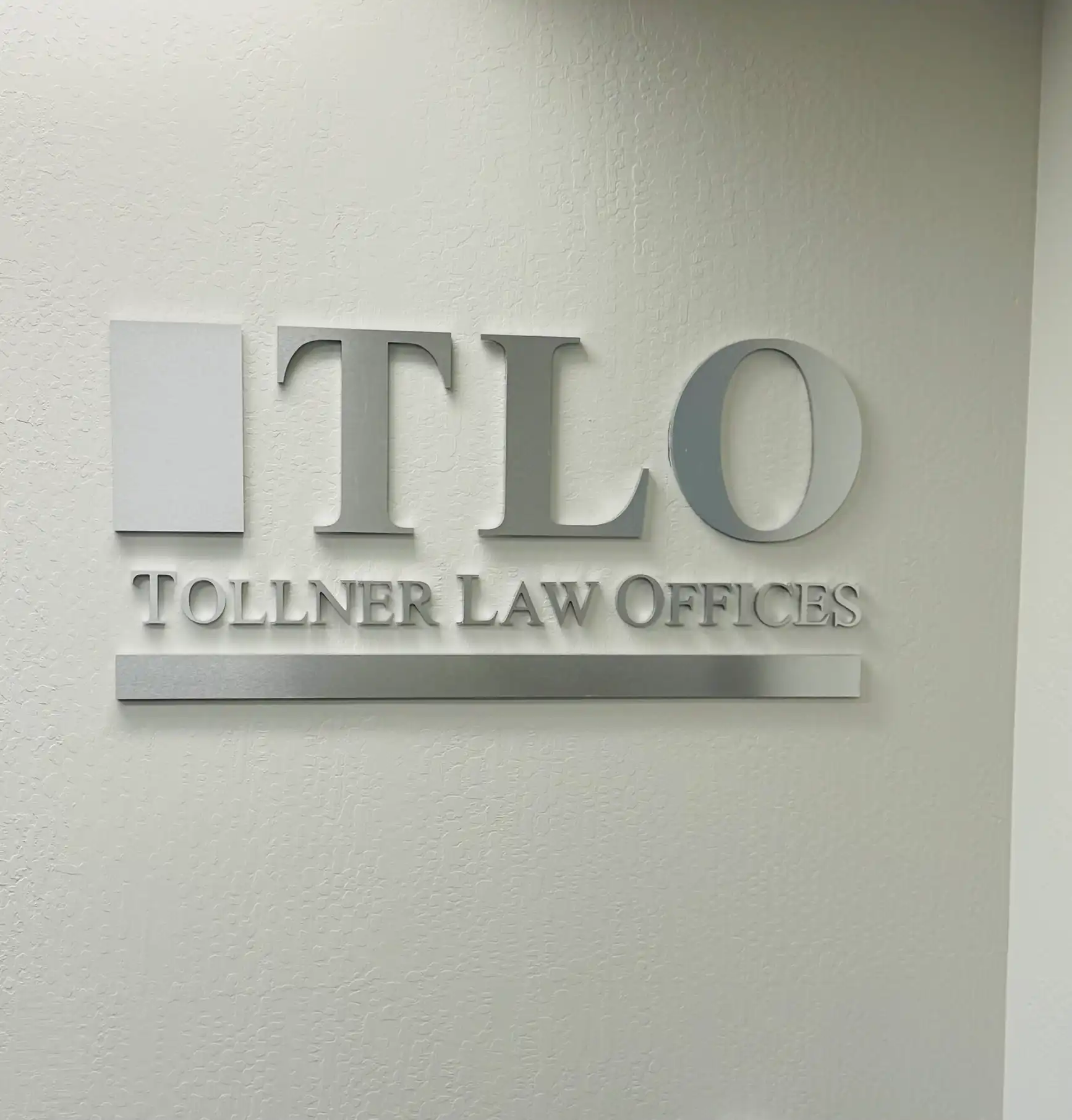 Tollner Law Offices dimensional lobby sign, painted acrylic with brushed aluminum face — Clear Line Signs San Jose