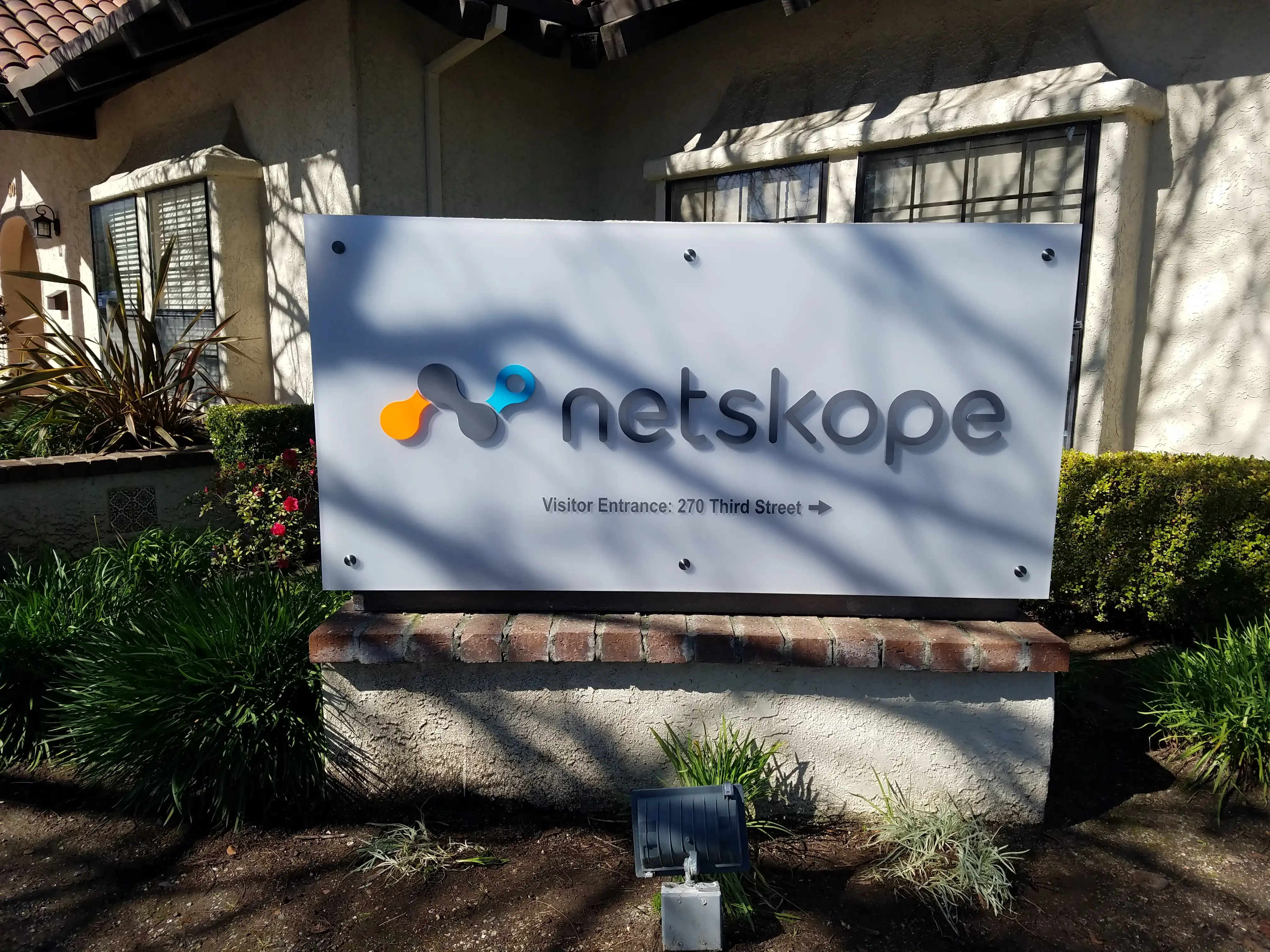 Netskope monument sign — acrylic letters and logo on acrylic panel with standoffs, Santa Clara
