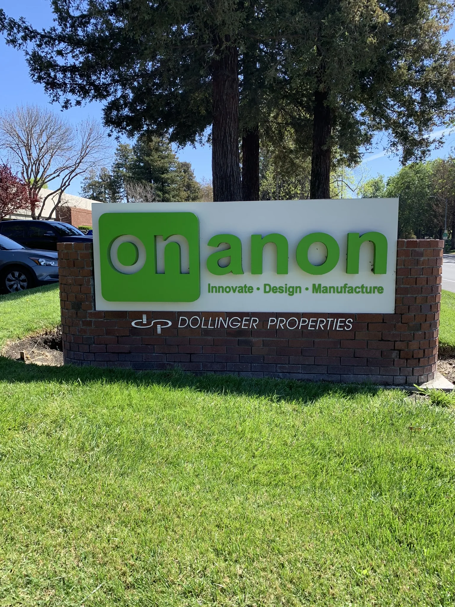 Onanon dimensional acrylic letter monument sign on brick base — Clear Line Signs Silicon Valley