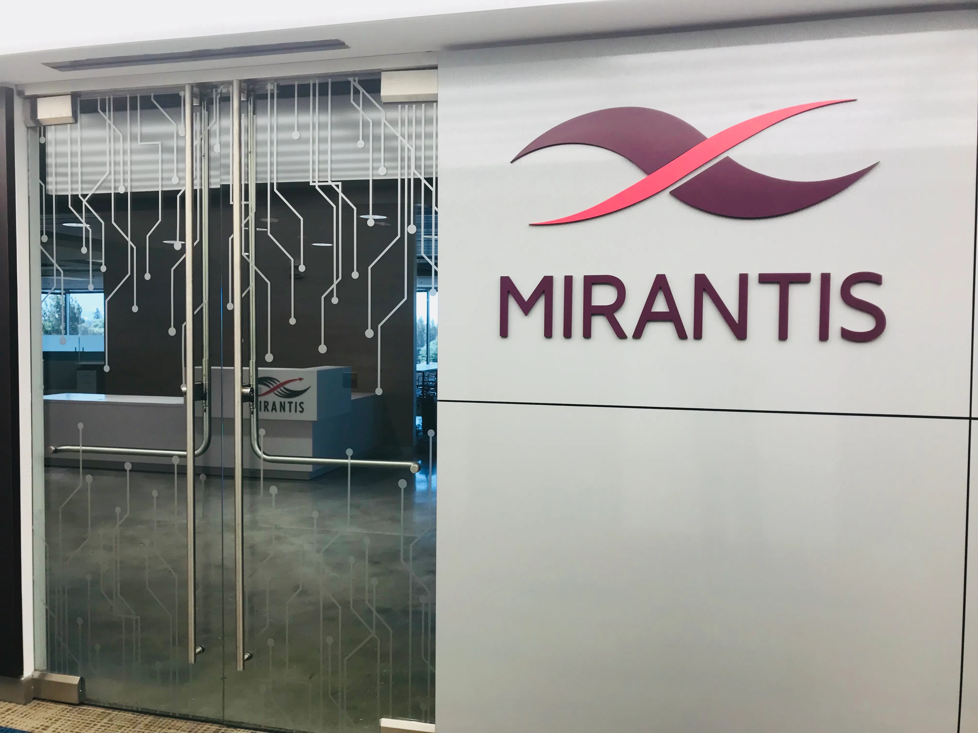 Mirantis lobby sign and window graphics