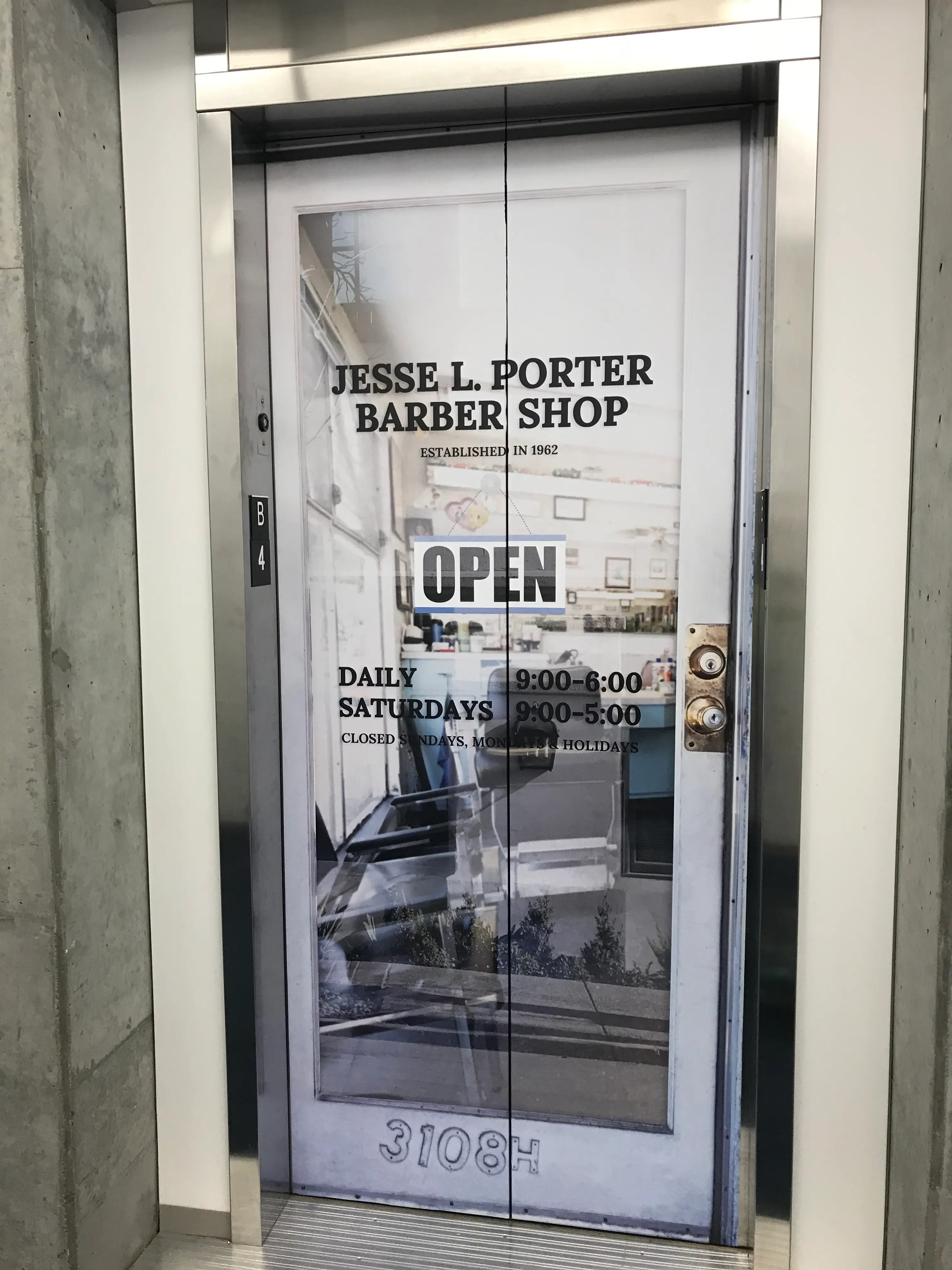 Full interior elevator cab wrap with lifestyle photography at Silicon Valley corporate campus