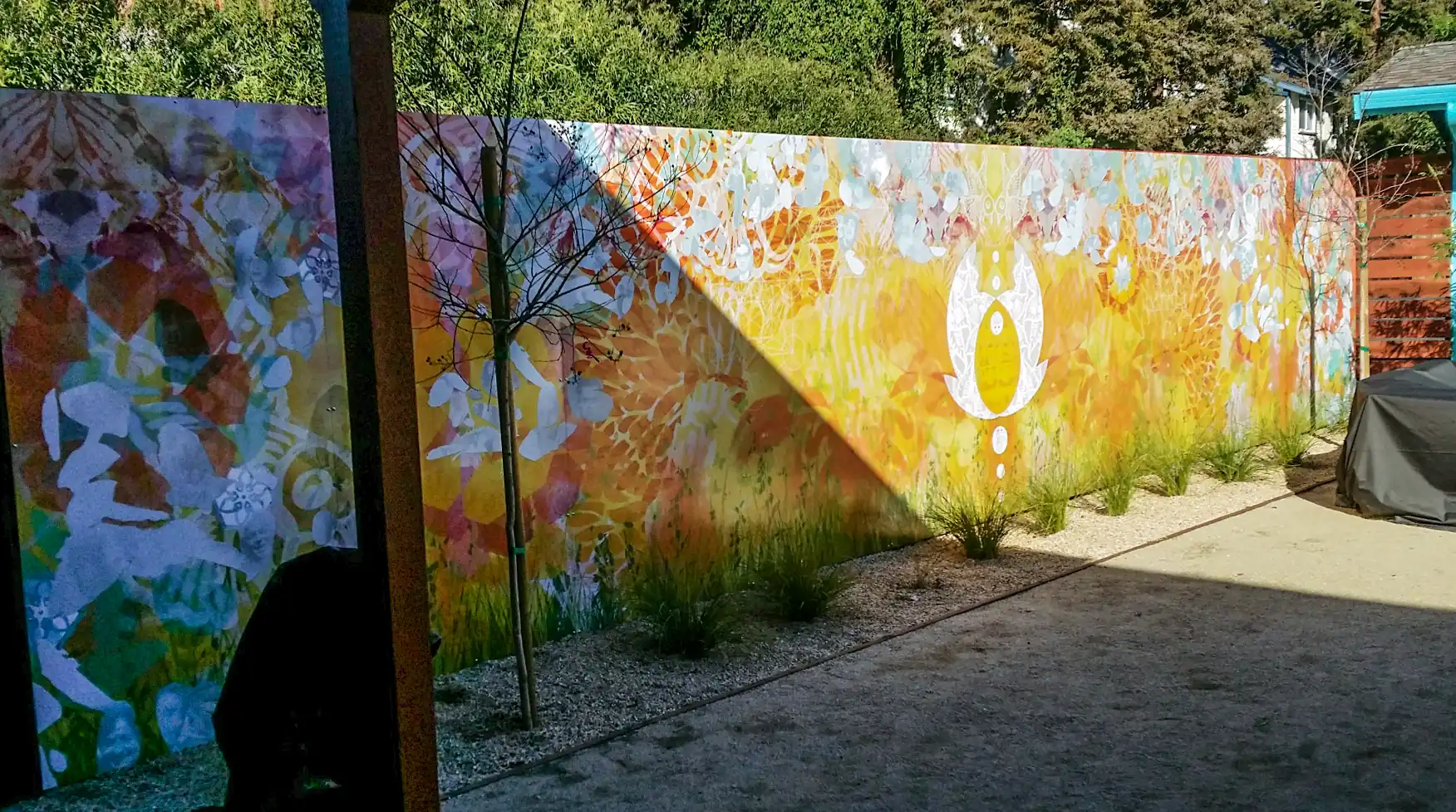 Outdoor vinyl wall wrap Priya Living exterior detail — Clear Line Signs