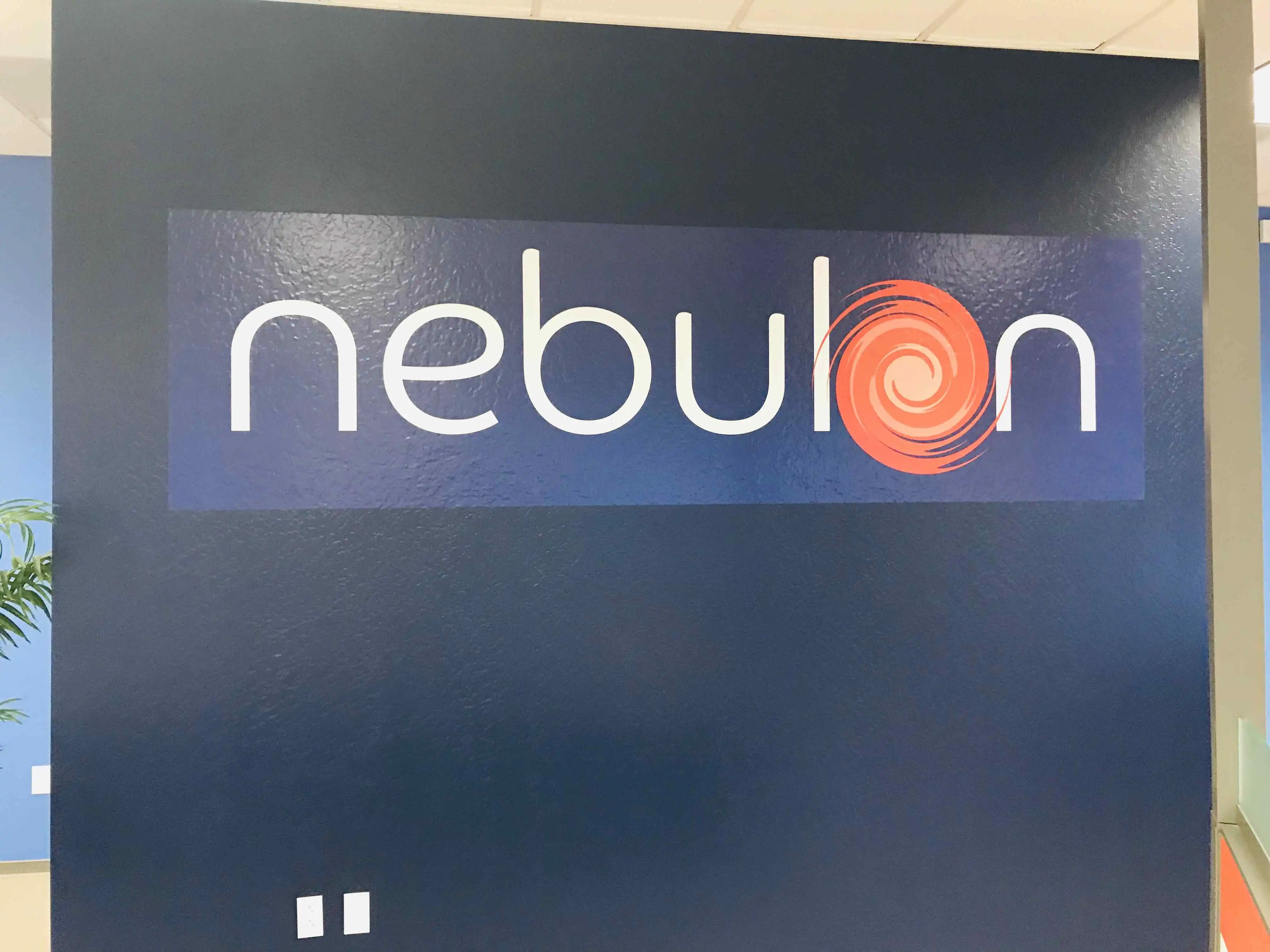 Nebulon orange accent wall decal vinyl swirl logo San Jose — Clear Line Signs