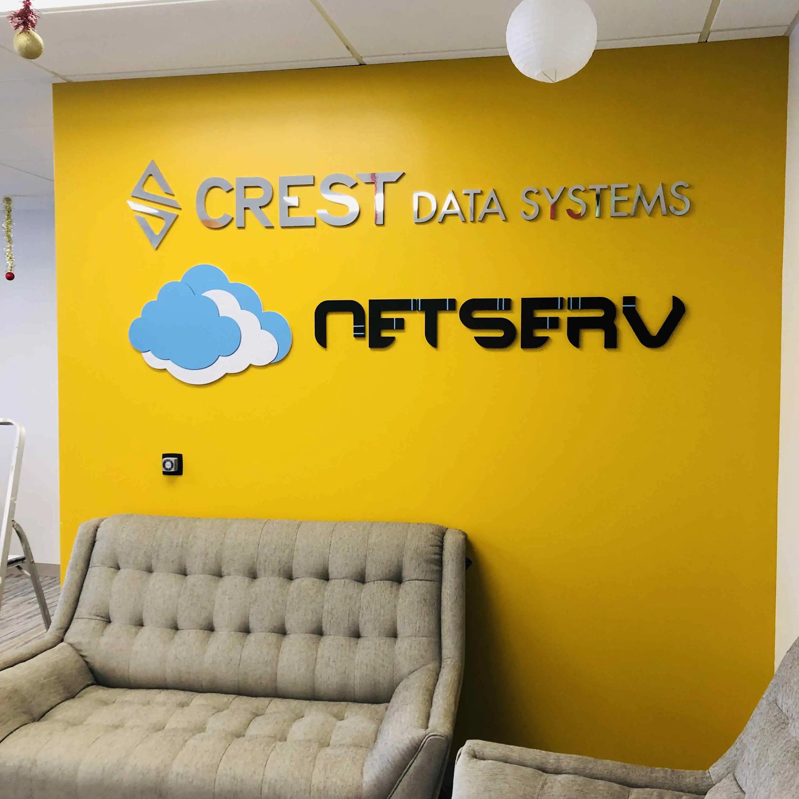 Crest Data Systems NGNetserv dimensional acrylic lobby signs yellow wall San Jose — Clear Line Signs