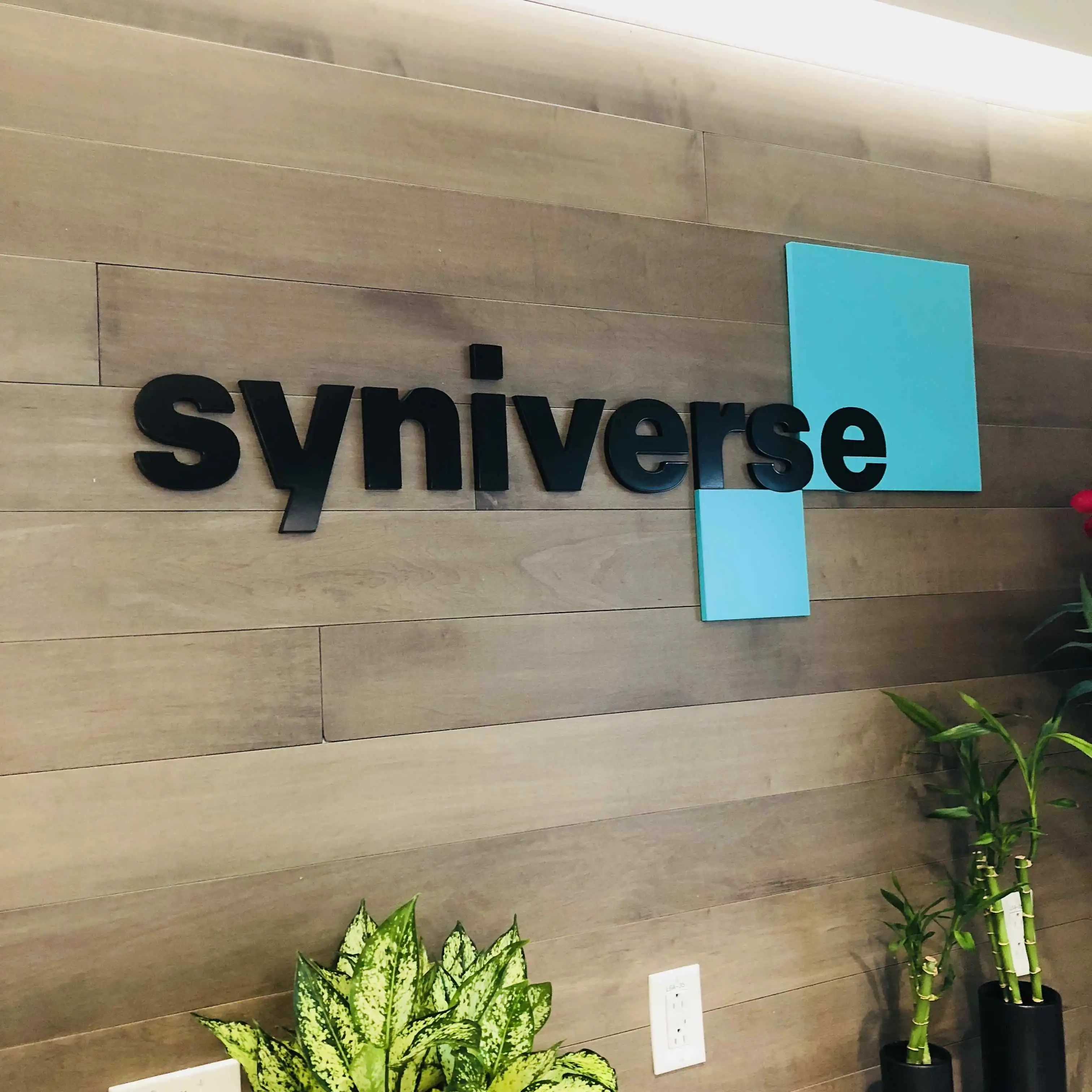 Syniverse dimensional acrylic lobby sign wood wall Silicon Valley — Clear Line Signs
