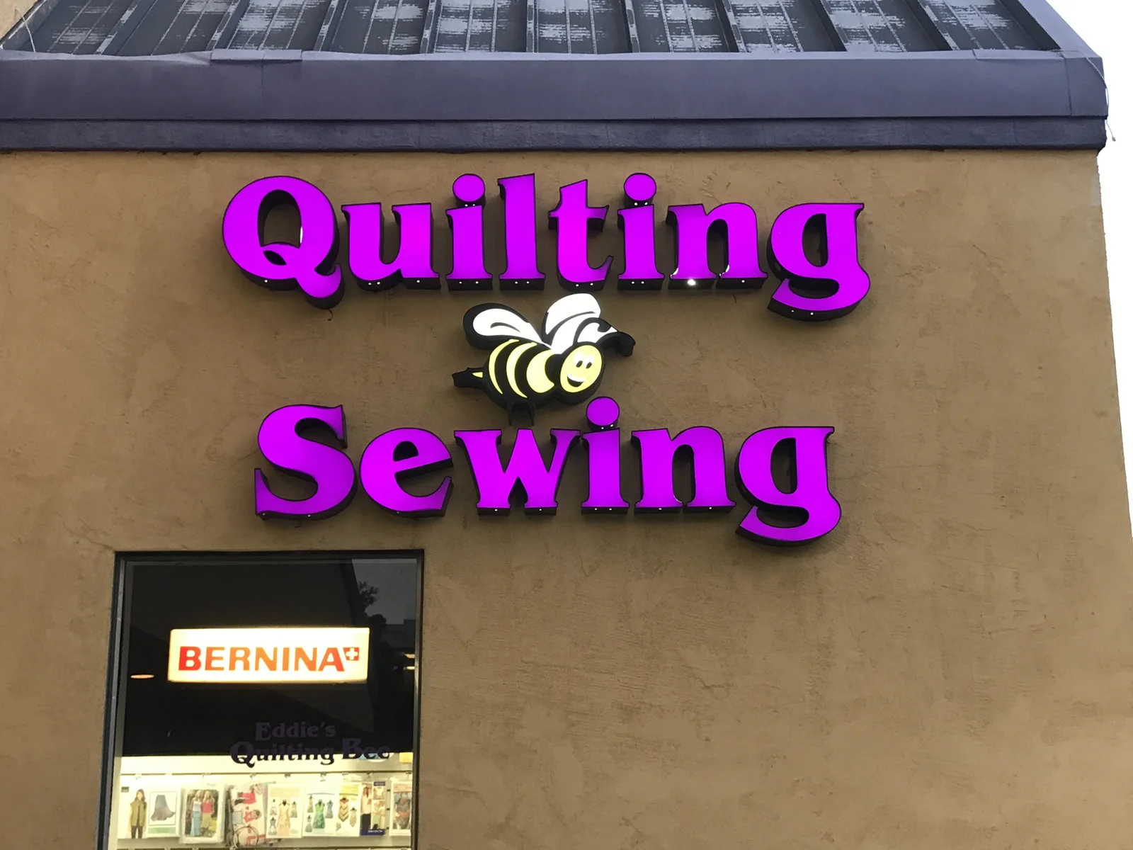 Eddie's Quilting Bee illuminated channel letters with custom bee logo Silicon Valley