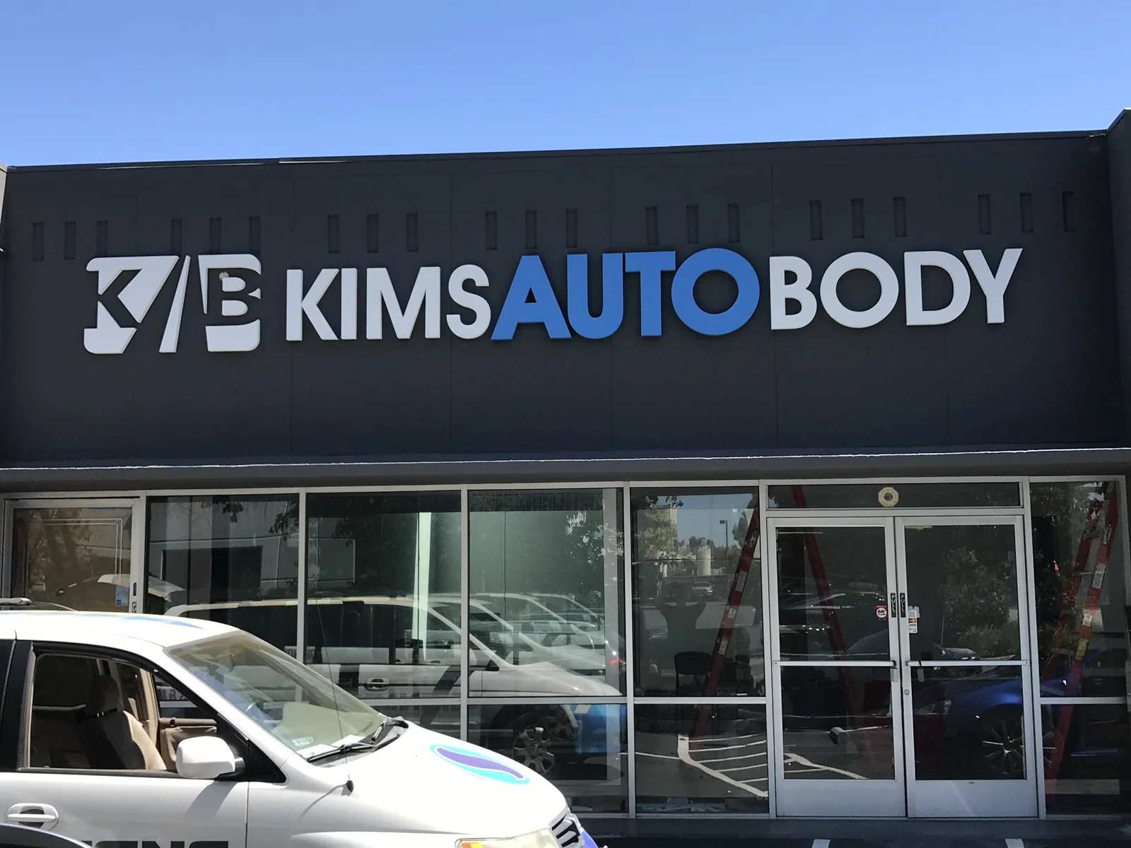 Kims Auto Body foam laminate face building sign San Jose storefront