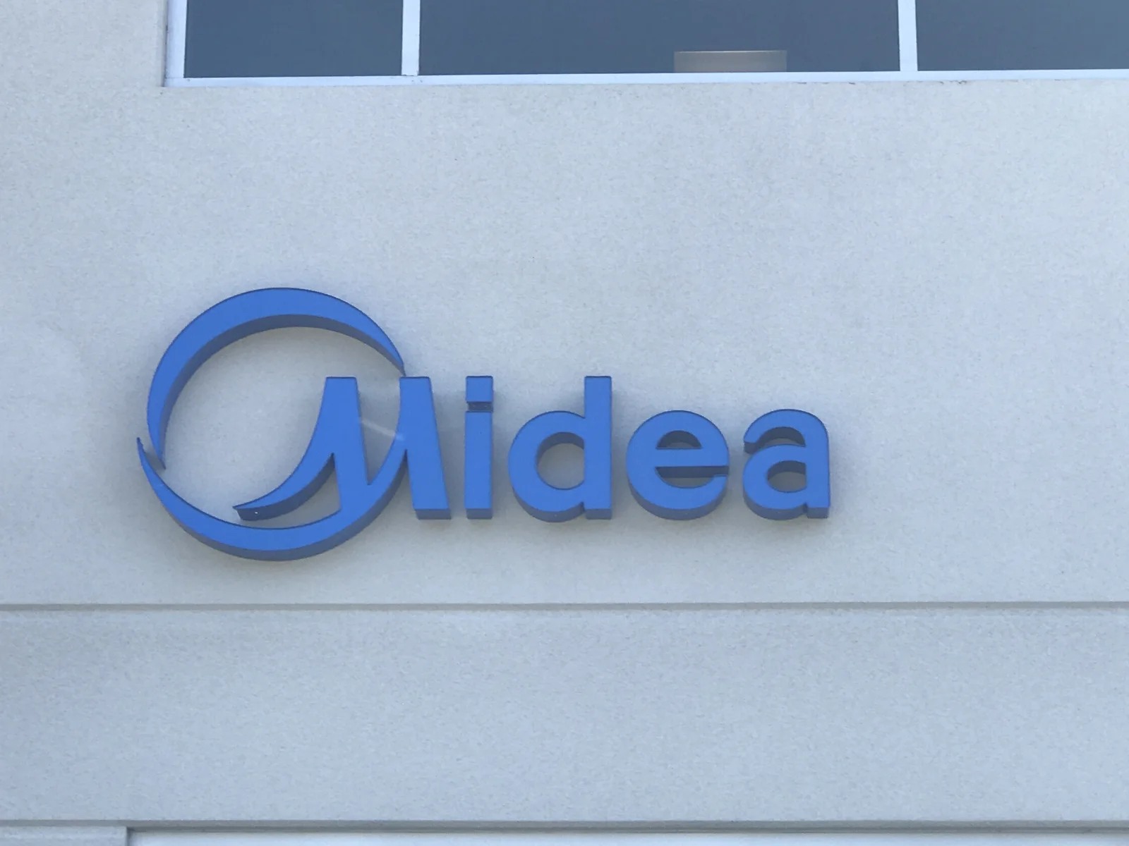 Midea dimensional building letters mounted on commercial building exterior Silicon Valley