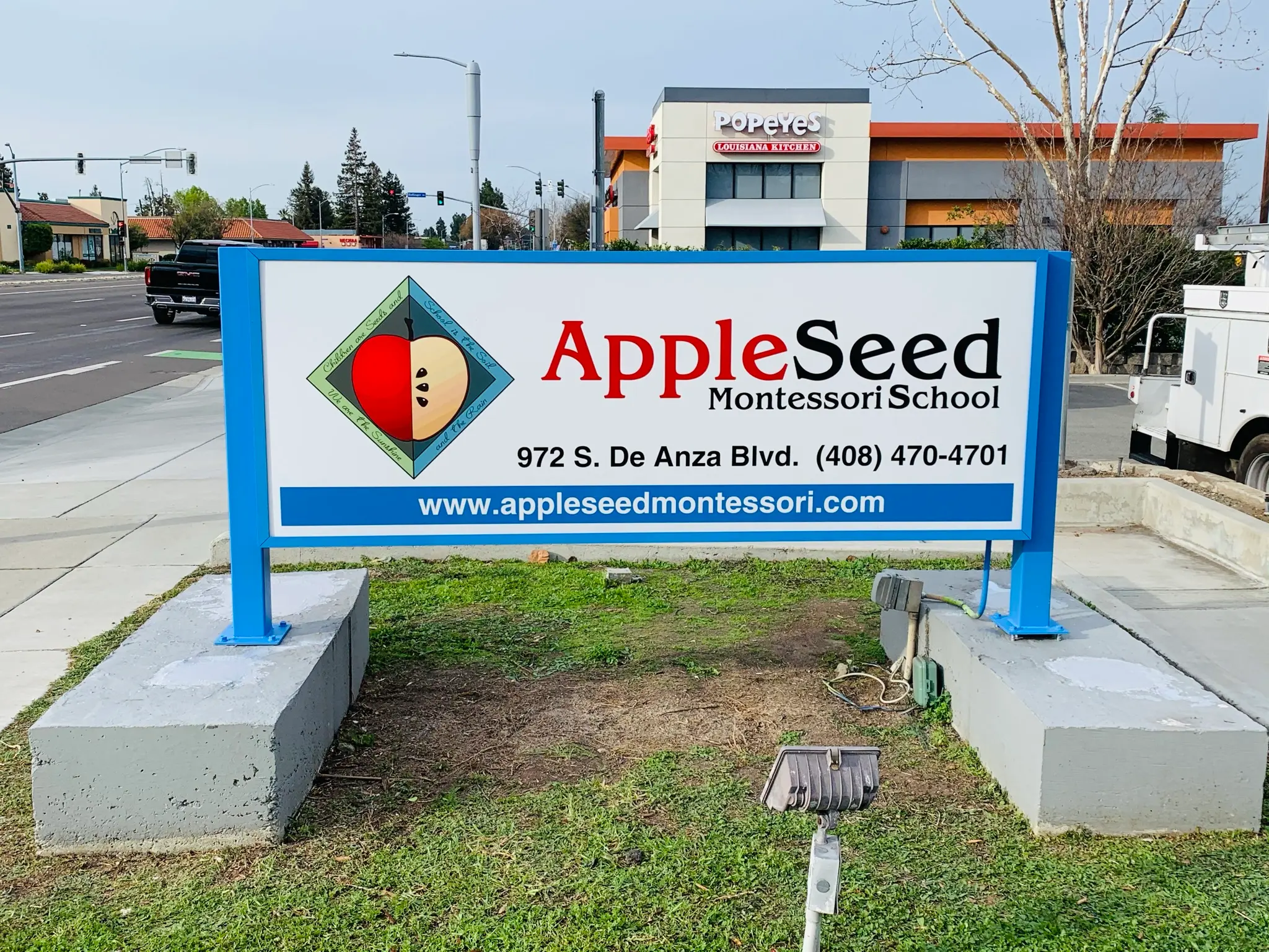 AppleSeed Montessori School lexan lightbox sign with translucent print vinyl on steel posts San Jose