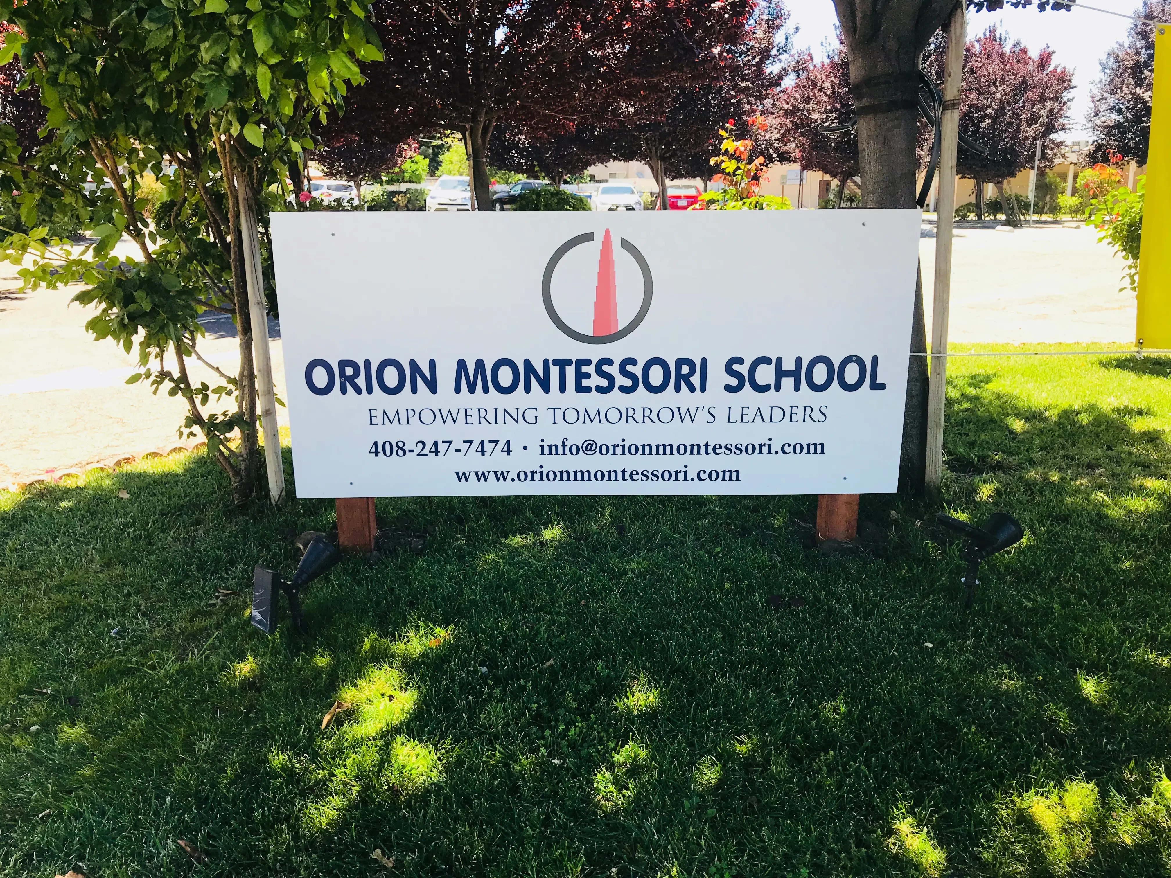Orion Montessori School post and panel sign on landscaped grounds Santa Clara County