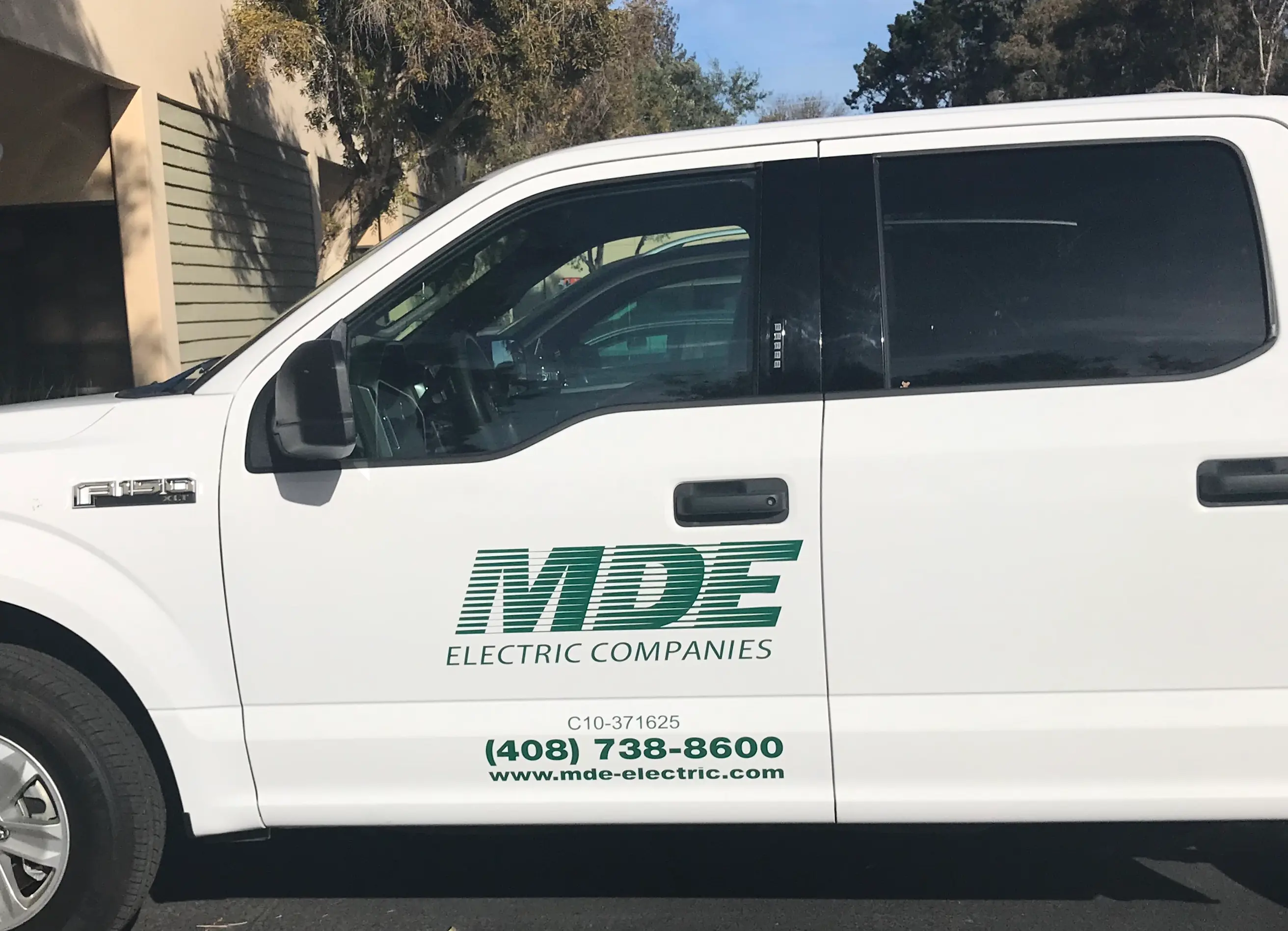 MDE Electric Companies cut vinyl logo on GMC Sierra truck door San Jose