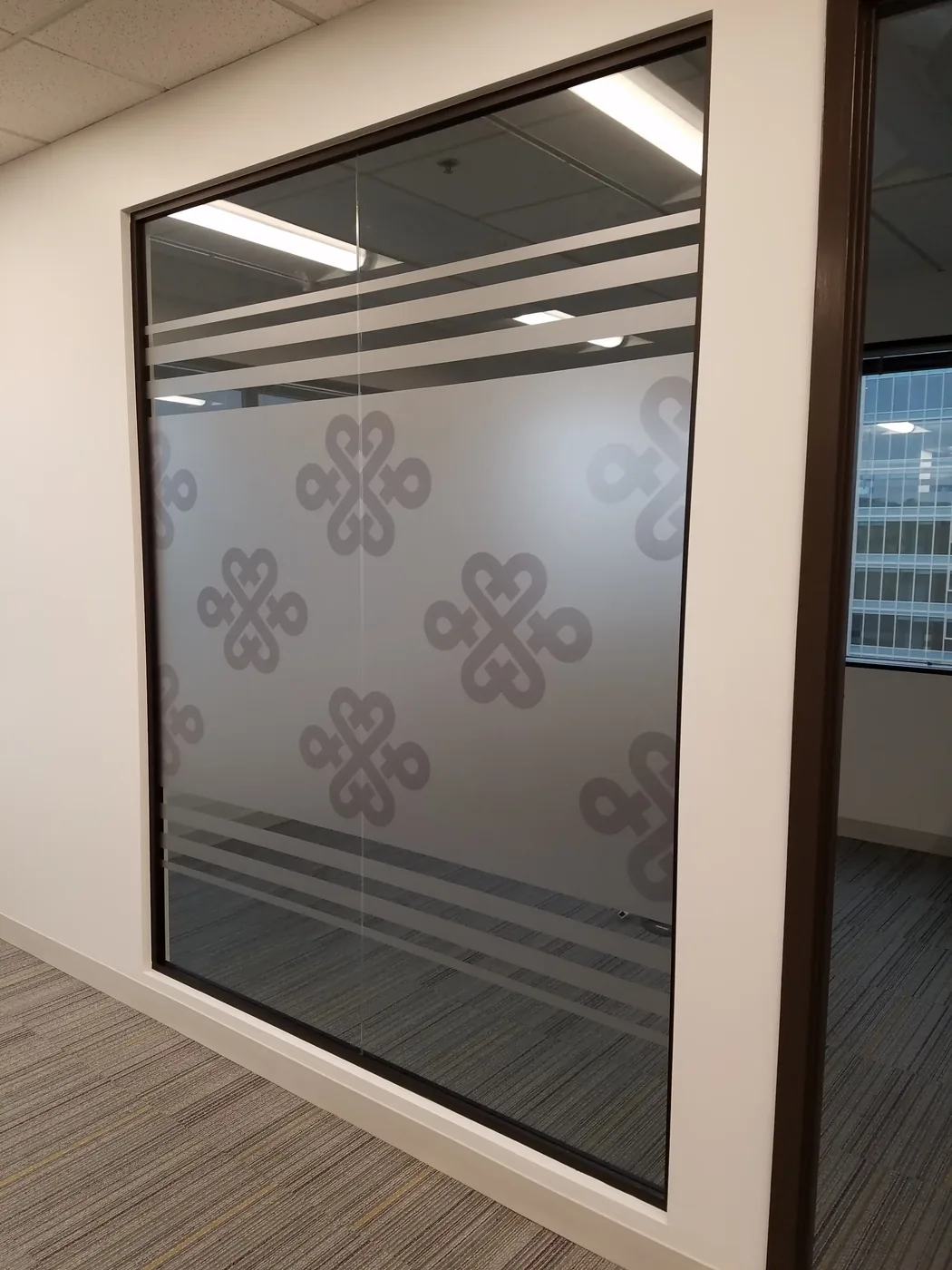 Cut vinyl frost on full-height office glass wall — commercial installation Silicon Valley
