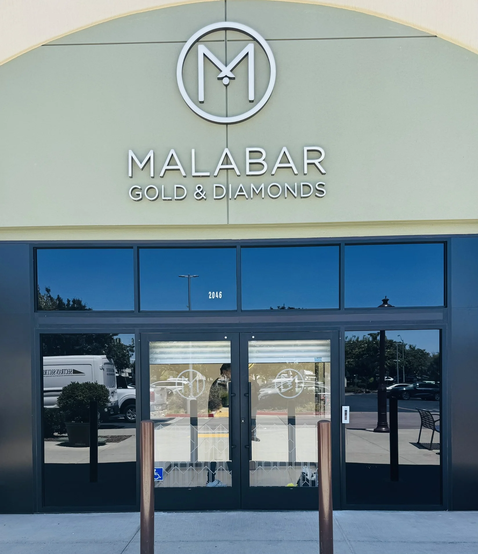 Malabar Gold Diamonds frosted glass doors logo medallion cut vinyl Santa Clara — Clear Line Signs